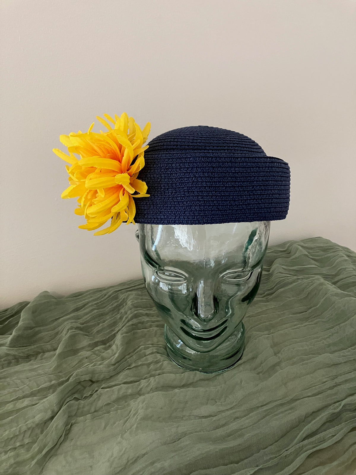 Ladies blue adjustable pillbox hat with bright yellow flowers
