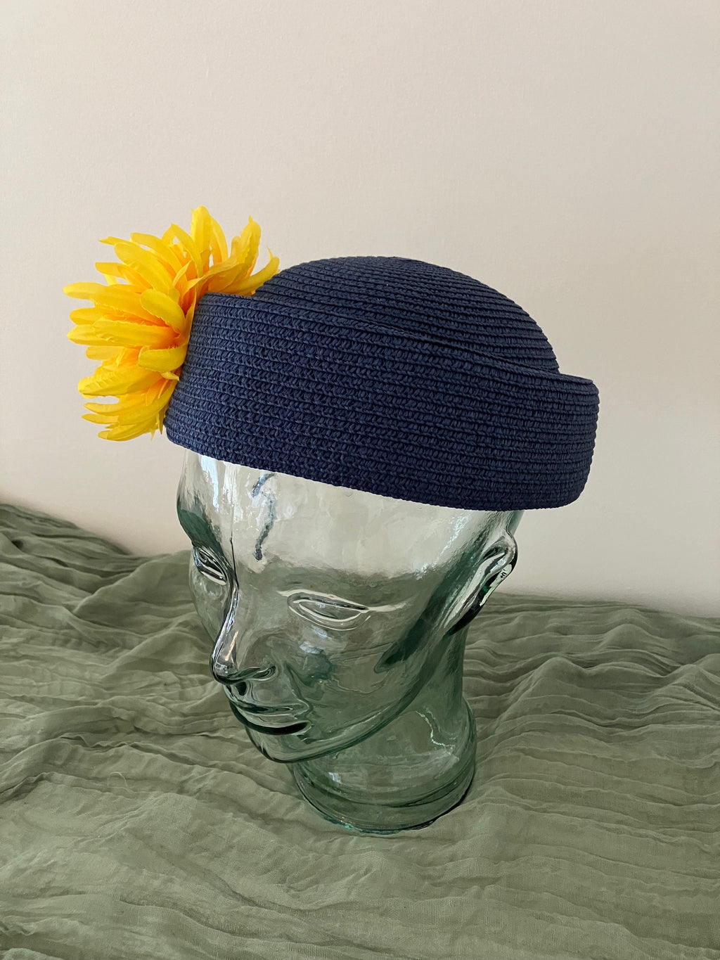 Ladies blue adjustable pillbox hat with bright yellow flowers