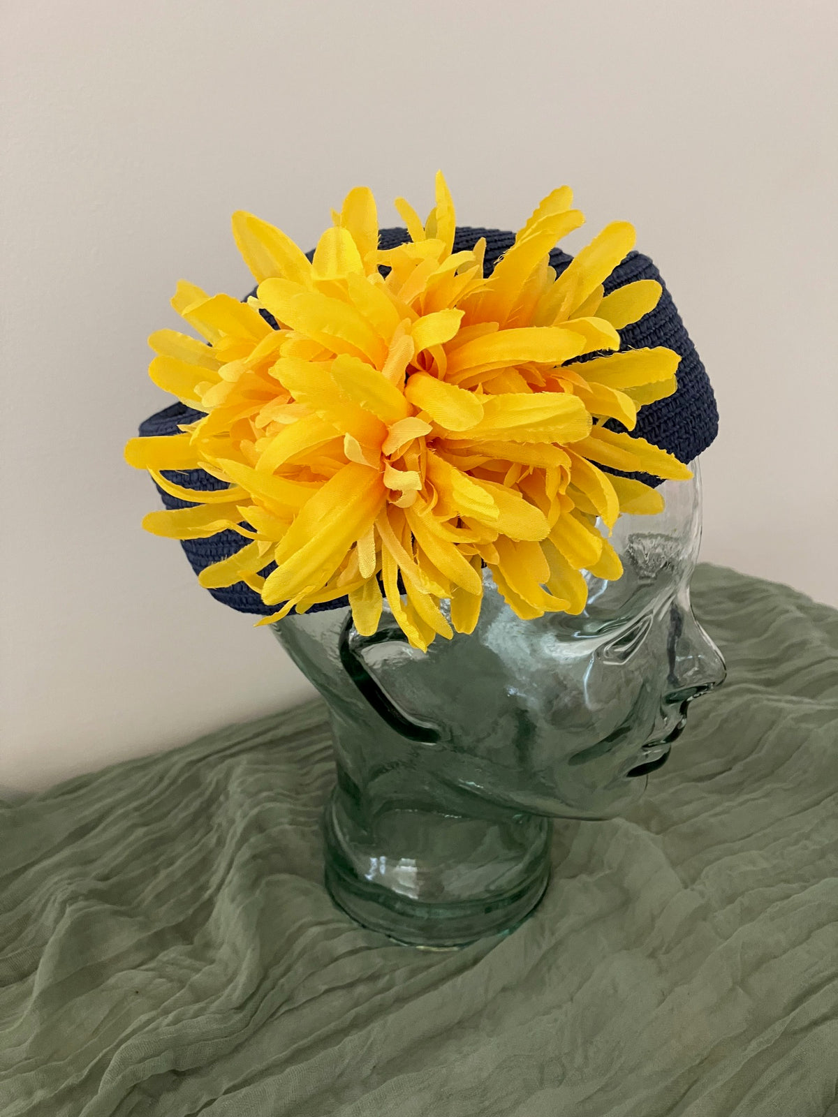 Ladies blue adjustable pillbox hat with bright yellow flowers