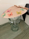 Ladies lightweight fascinator in a light peach-beige color with colorful fabric butterfies.