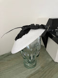Ladies black and white fascinator hat with black butterfies