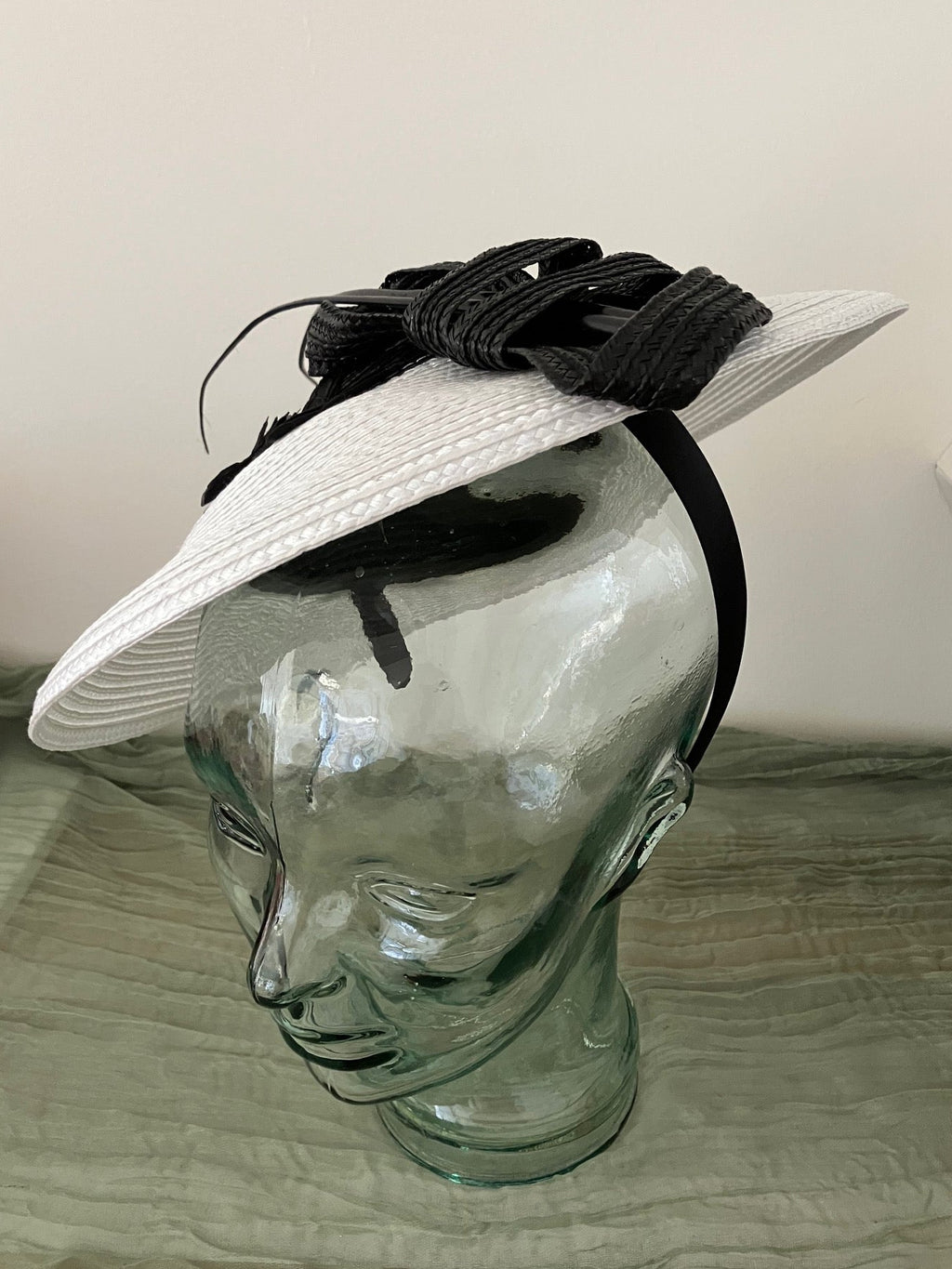 Ladies black and white fascinator hat with black butterfies