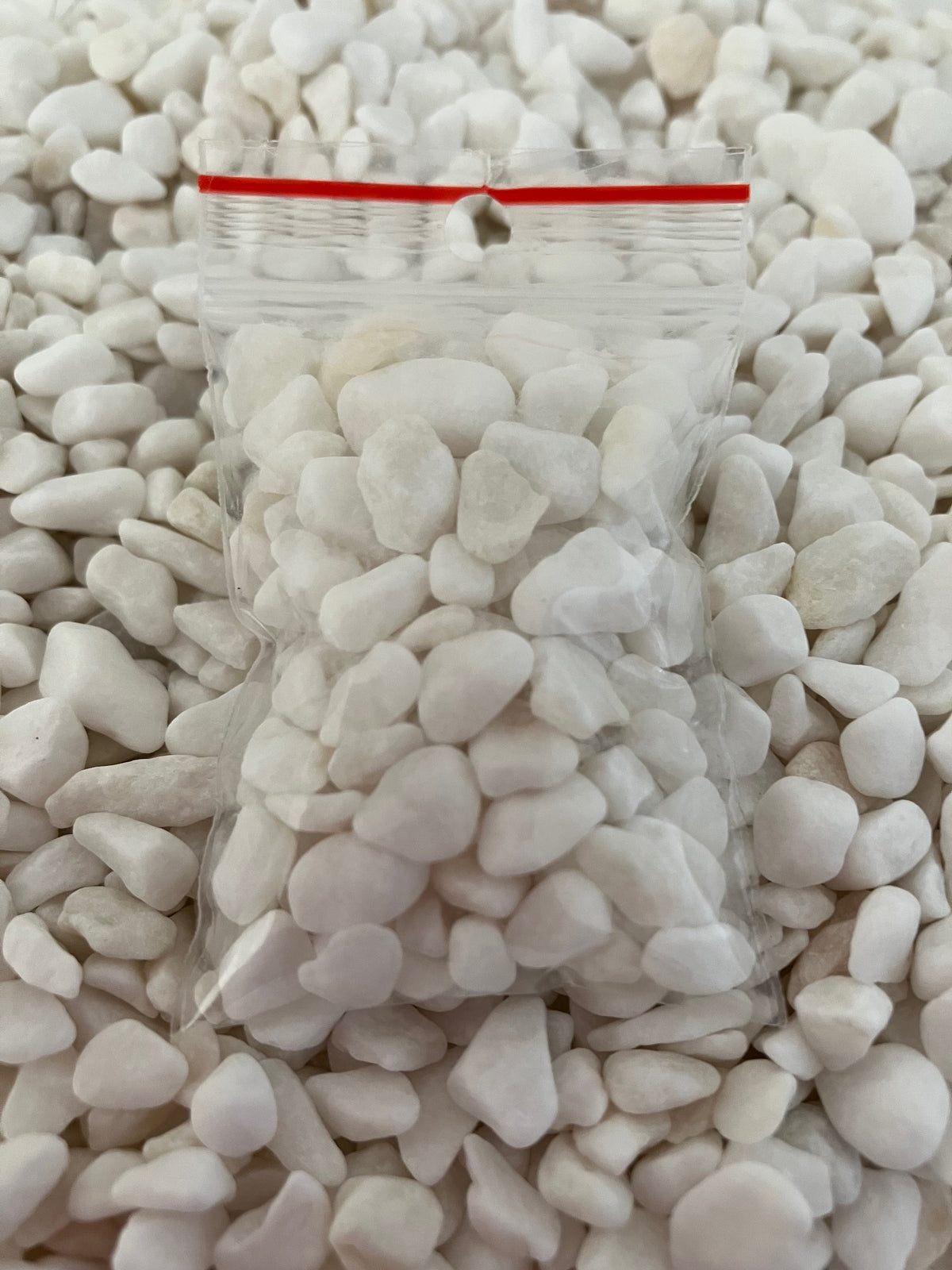 Bag of white pebbles