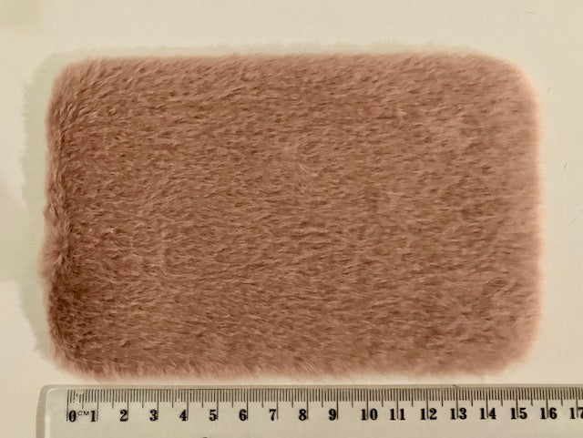 A rectangular, fuzzy faux fur fabric swatch in a dusty rose-brown color, shown with a ruler at the bottom to indicate scale.